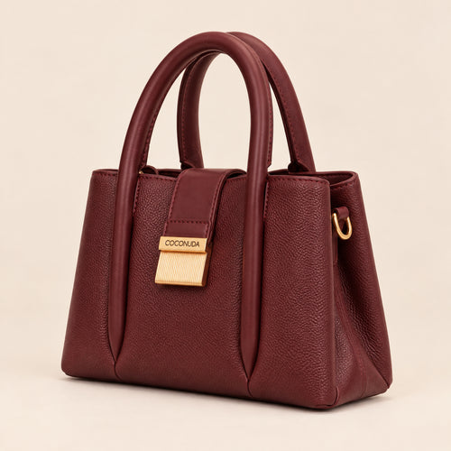 City Bag Coconuda Borgogna, vista di tre quarti con placca dorata