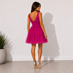 Abito Claudette fucsia in tulle glitterato, vista posteriore a figura intera