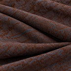 Dettaglio del tessuto fantasia marrone e blu del pantalone Texas